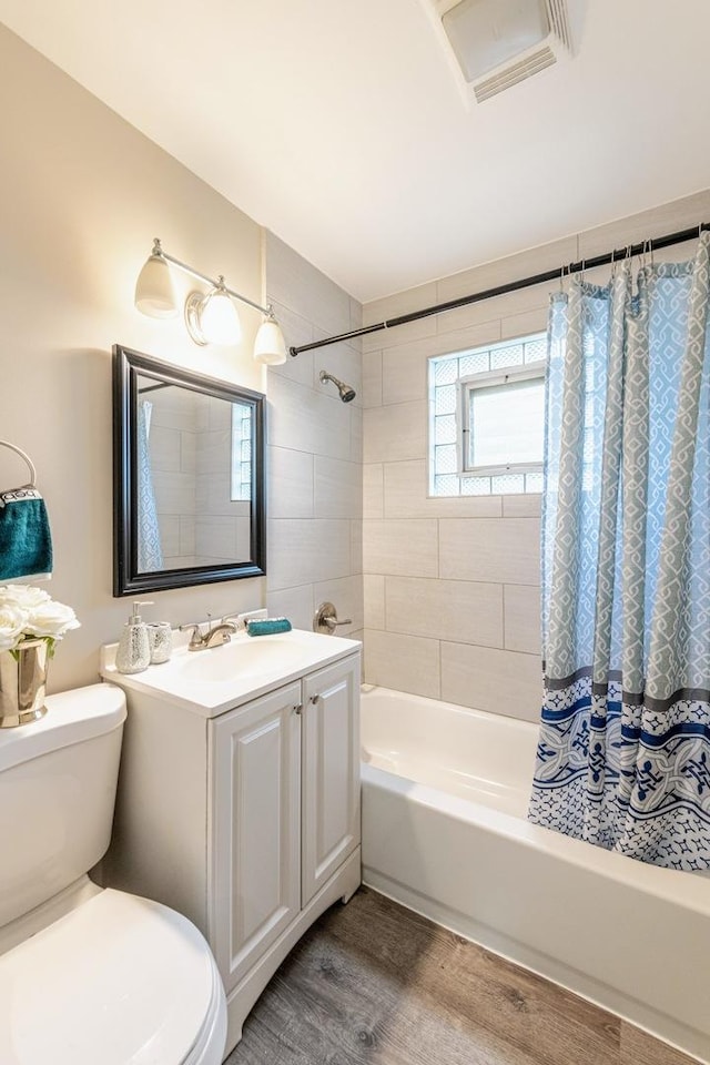1502 N 34th Ave, Melrose Park, IL 60160 - bathroom with shower / tub combo with curtain, wood finished floors, and vanity