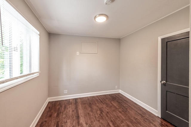 1502 N 34th Ave, Melrose Park, IL 60160 - empty room with dark wood-type flooring and a smoke detector