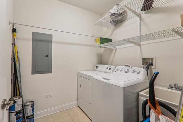 1200 N Foxdale Dr Unit 312, Addison, IL 60101 - washroom featuring electric panel, washer and dryer, and light tile patterned flooring