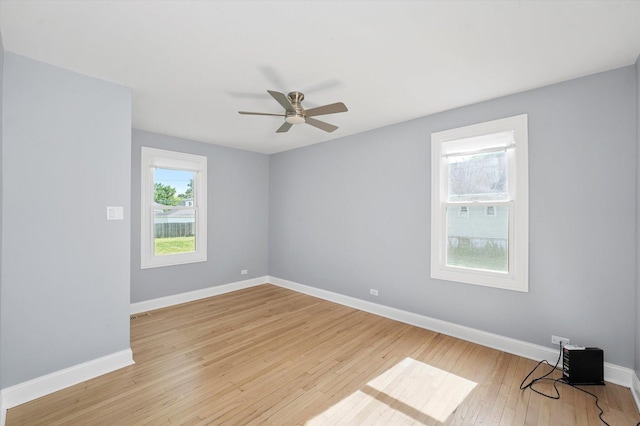 536 E 155th St, Phoenix, IL 60426 - empty room with light wood-style floors and a ceiling fan