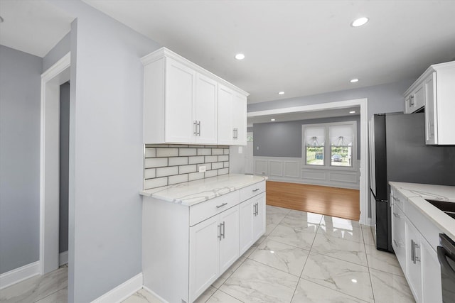 536 E 155th St, Phoenix, IL 60426 - kitchen featuring light marble finish flooring, white cabinetry, recessed lighting, light stone counters, and dishwashing machine