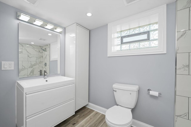 536 E 155th St, Phoenix, IL 60426 - full bath featuring wood finished floors, vanity, and recessed lighting