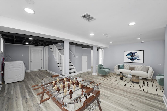 536 E 155th St, Phoenix, IL 60426 - living area featuring light wood finished floors, stairs, and recessed lighting