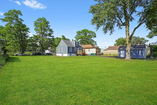 536 E 155th St, Phoenix, IL 60426 - view of grassy yard featuring an outdoor structure