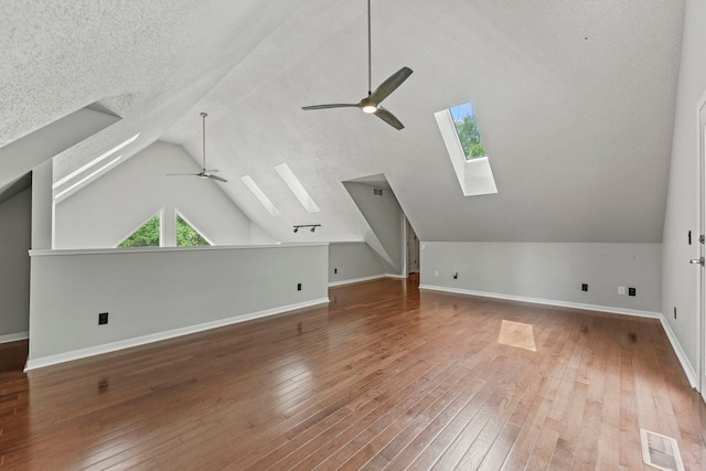 4293 W Rockton Rd, Rockton, IL 61072 - bonus room featuring a skylight, a ceiling fan, vaulted ceiling, hardwood / wood-style floors, and a textured ceiling