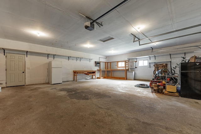 4293 W Rockton Rd, Rockton, IL 61072 - garage with freestanding refrigerator and a garage door opener