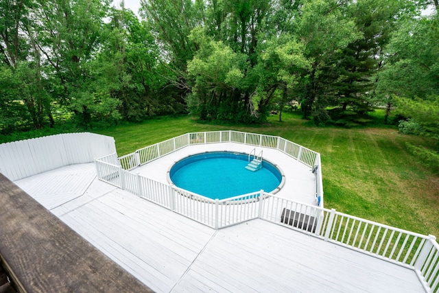 4293 W Rockton Rd, Rockton, IL 61072 - swimming pool with a yard, a wooden deck, and view of wooded area