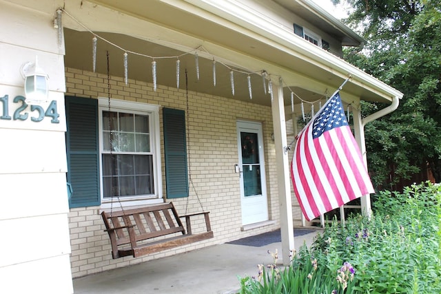 1254 Blackhawk Dr, Elgin, IL 60120 - entrance to property with a porch and brick siding