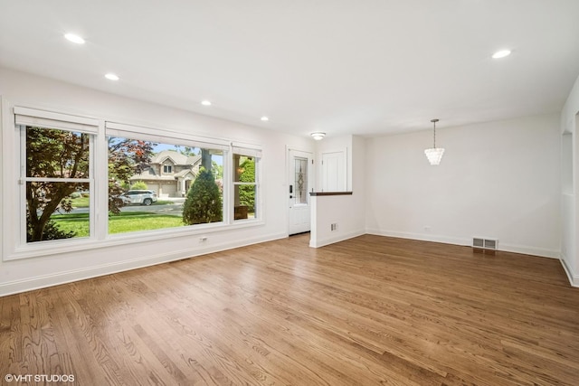 630 Wesley Dr, Park Ridge, IL 60068 - unfurnished living room featuring light wood-type flooring and recessed lighting