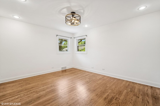 630 Wesley Dr, Park Ridge, IL 60068 - empty room with a chandelier, light wood finished floors, and recessed lighting