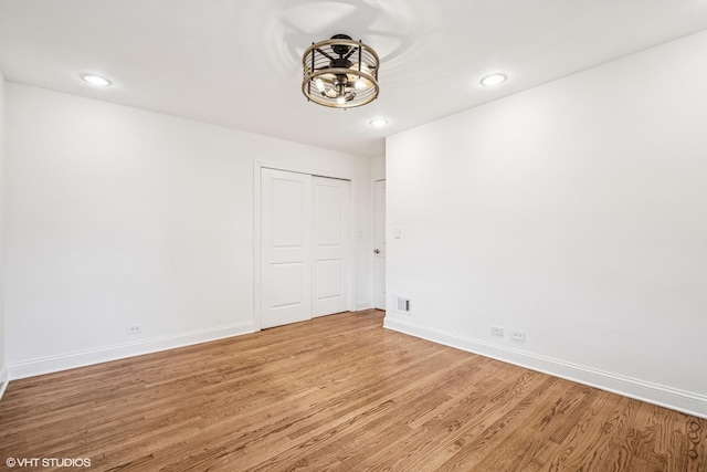 630 Wesley Dr, Park Ridge, IL 60068 - spare room with wood finished floors, recessed lighting, and a chandelier