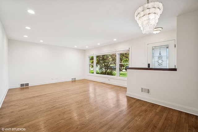 630 Wesley Dr, Park Ridge, IL 60068 - spare room with a chandelier, wood finished floors, and recessed lighting