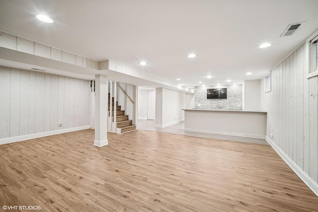 630 Wesley Dr, Park Ridge, IL 60068 - finished basement with light wood-style floors, wood walls, stairs, and recessed lighting