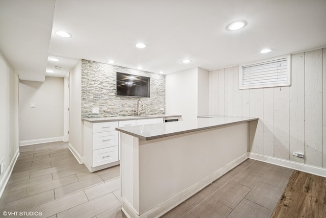630 Wesley Dr, Park Ridge, IL 60068 - bar featuring tasteful backsplash, light wood-type flooring, wooden walls, and recessed lighting