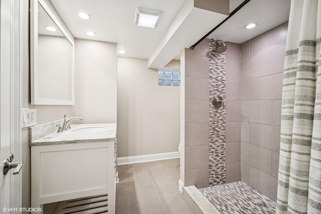630 Wesley Dr, Park Ridge, IL 60068 - bathroom with double vanity, a tile shower, and recessed lighting