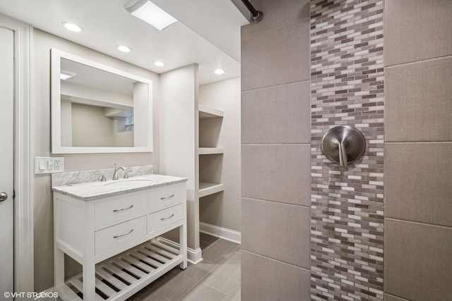 630 Wesley Dr, Park Ridge, IL 60068 - full bath with vanity, recessed lighting, a tile shower, and wood finished floors