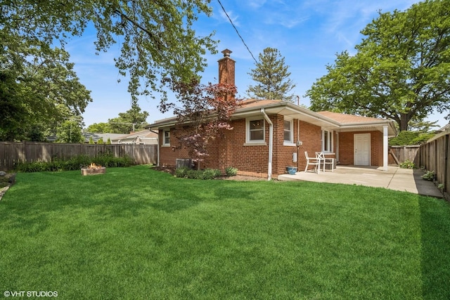 630 Wesley Dr, Park Ridge, IL 60068 - rear view of property featuring a chimney, brick siding, a fenced backyard, and a patio area
