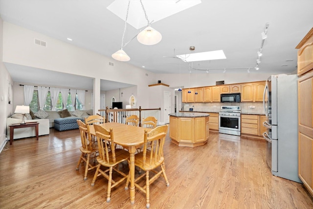8950 S 84th Ave, Hickory Hills, IL 60457 - dining space featuring a skylight, light wood-style flooring, and track lighting