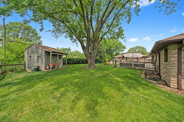 8950 S 84th Ave, Hickory Hills, IL 60457 - view of grassy yard featuring a storage shed and a wooden deck