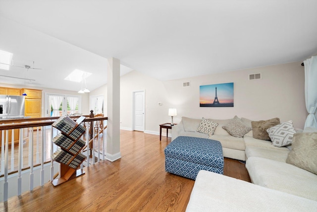8950 S 84th Ave, Hickory Hills, IL 60457 - living area featuring a skylight, light wood finished floors, and lofted ceiling