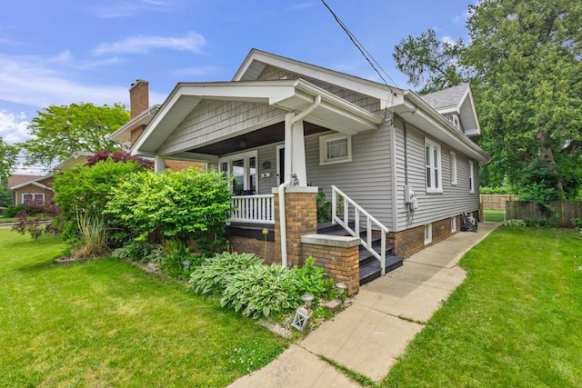 2417 Crosby St, Rockford, IL 61107 - view of front of house featuring covered porch and a chimney