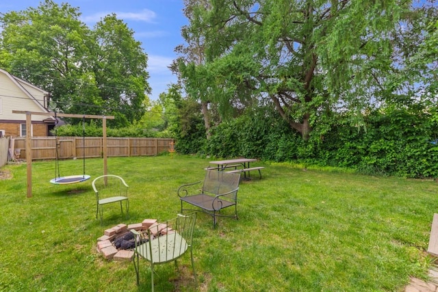2417 Crosby St, Rockford, IL 61107 - view of yard featuring a fire pit and view of wooded area