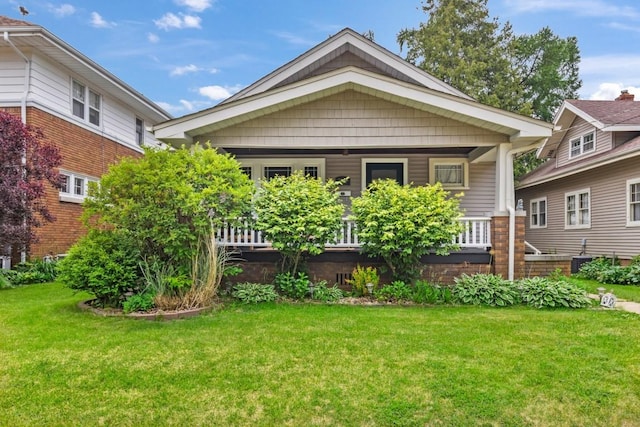 2417 Crosby St, Rockford, IL 61107 - back of house with a yard and covered porch