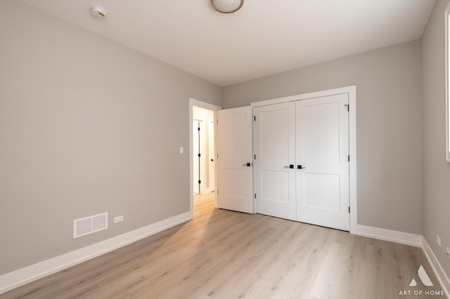 77371/2 Nashville Ave, Burbank, IL 60459 - unfurnished bedroom with light wood-type flooring and a closet