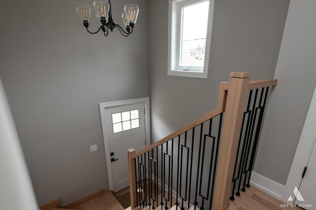 77371/2 Nashville Ave, Burbank, IL 60459 - stairway with a chandelier, plenty of natural light, and wood finished floors