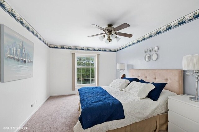 128 Carriage Way Dr Unit 217B, Burr Ridge, IL 60527 - carpeted bedroom with baseboards and ceiling fan