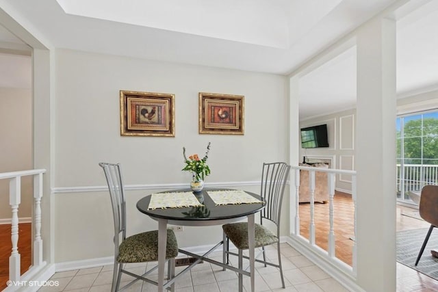 128 Carriage Way Dr Unit 217B, Burr Ridge, IL 60527 - dining space featuring light tile patterned floors and baseboards