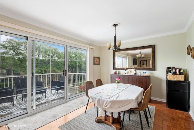 128 Carriage Way Dr Unit 217B, Burr Ridge, IL 60527 - dining space featuring a chandelier and crown molding