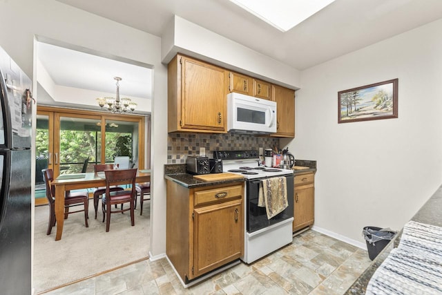 720 Saint Andrews Ln Unit 6, Crystal Lake, IL 60014 - kitchen with white appliances, a chandelier, tasteful backsplash, dark countertops, and brown cabinets