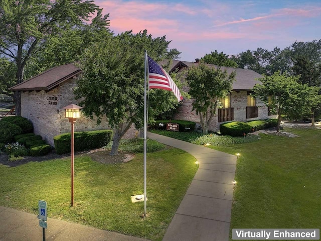720 Saint Andrews Ln Unit 6, Crystal Lake, IL 60014 - obstructed view of property featuring brick siding and a front yard