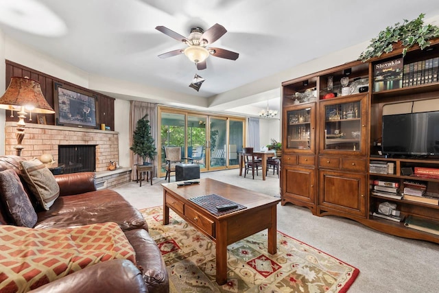 720 Saint Andrews Ln Unit 6, Crystal Lake, IL 60014 - living area featuring a ceiling fan, light colored carpet, a brick fireplace, and a chandelier