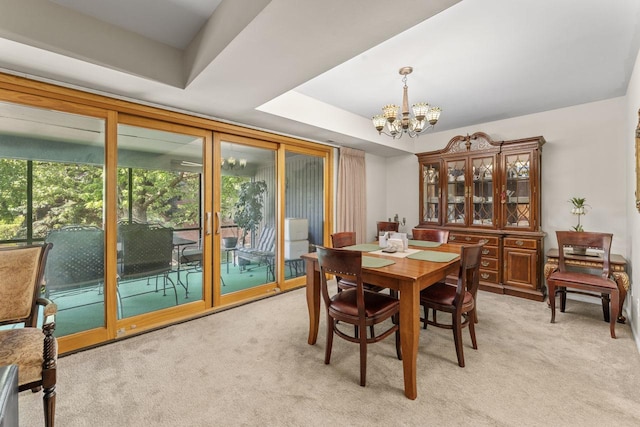 720 Saint Andrews Ln Unit 6, Crystal Lake, IL 60014 - dining space with a chandelier, light colored carpet, and a tray ceiling