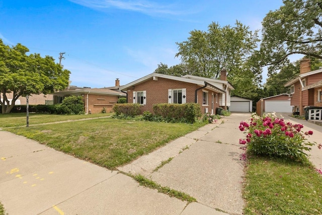 8429 Mason Ave, Morton Grove, IL 60053 - view of front of home with brick siding, a detached garage, a chimney, a front lawn, and an outbuilding