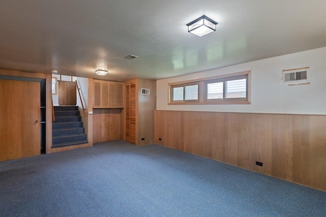 8429 Mason Ave, Morton Grove, IL 60053 - basement with carpet floors, stairs, wooden walls, and a wainscoted wall