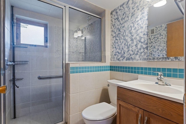 8429 Mason Ave, Morton Grove, IL 60053 - full bath featuring wallpapered walls, tile walls, a shower stall, vanity, and wainscoting