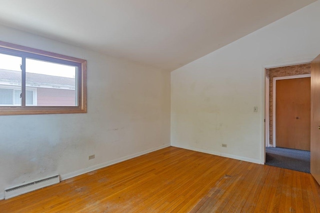 8429 Mason Ave, Morton Grove, IL 60053 - empty room featuring a baseboard radiator and light wood finished floors