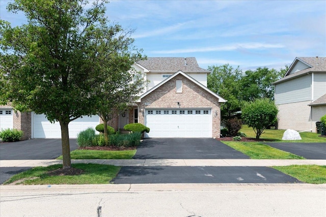 18374 Century Ct, Tinley Park, IL 60477 - traditional-style house featuring asphalt driveway, an attached garage, and brick siding