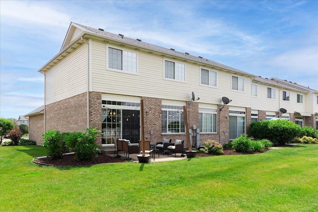 18374 Century Ct, Tinley Park, IL 60477 - back of property with brick siding, a lawn, outdoor lounge area, and a patio