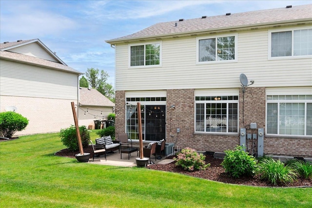 18374 Century Ct, Tinley Park, IL 60477 - back of property featuring brick siding, a yard, a patio area, and an outdoor hangout area