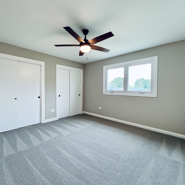 15564 S Willow Ct, Homer Glen, IL 60491 - unfurnished bedroom with multiple closets, carpet flooring, and ceiling fan