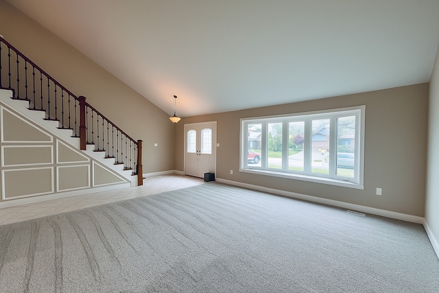 15564 S Willow Ct, Homer Glen, IL 60491 - unfurnished living room featuring carpet, vaulted ceiling, and stairway