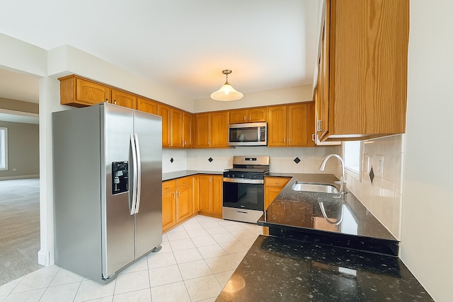 15564 S Willow Ct, Homer Glen, IL 60491 - kitchen with appliances with stainless steel finishes, light tile patterned floors, dark stone counters, and backsplash