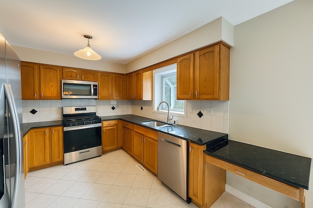 15564 S Willow Ct, Homer Glen, IL 60491 - kitchen with stainless steel appliances, brown cabinetry, tasteful backsplash, and light tile patterned floors