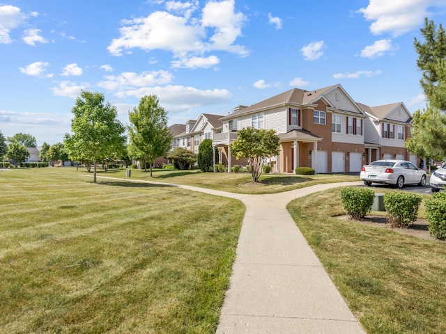 4231 Savoy Ln Unit 4231, Mchenry, IL 60050 - view of community featuring a residential view, an attached garage, asphalt driveway, and a yard