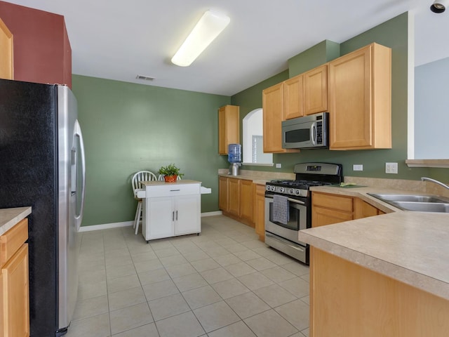 4231 Savoy Ln Unit 4231, Mchenry, IL 60050 - kitchen with appliances with stainless steel finishes, light brown cabinets, light tile patterned floors, and light countertops