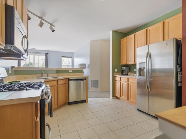 4231 Savoy Ln Unit 4231, Mchenry, IL 60050 - kitchen with appliances with stainless steel finishes, rail lighting, light countertops, a peninsula, and light tile patterned floors